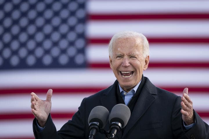 Democratic presidential nominee Joe Biden speaks during a drive-in campaign rally in Iowa. 30 October (file).