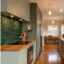 In This Kitchen, The Olive-toned Cabinetry And Striking Tiled Backsplash Create A Serene, Nature-inspired Backdrop: Cunningham Construction